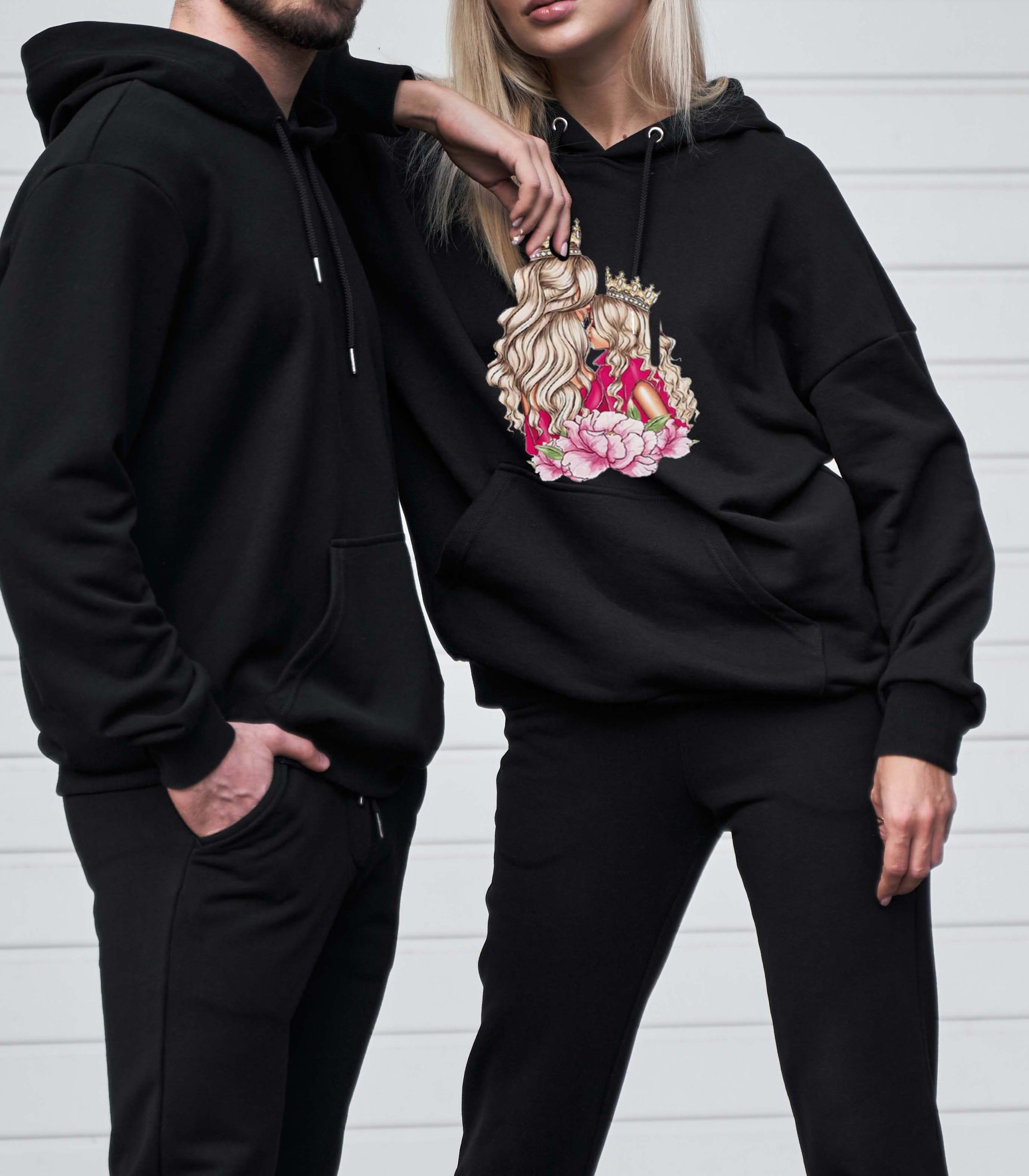 Woman and man wear black hoodie without a logo. No logo basic sportswear. Long sleeve sweatshirt mockup